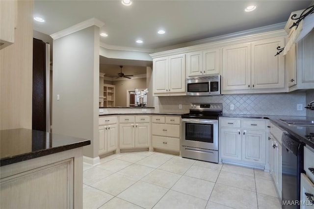 5906 Amberwood Ln, Montgomery, AL 36116 - kitchen with appliances with stainless steel finishes, crown molding, backsplash, a ceiling fan, and light tile patterned flooring