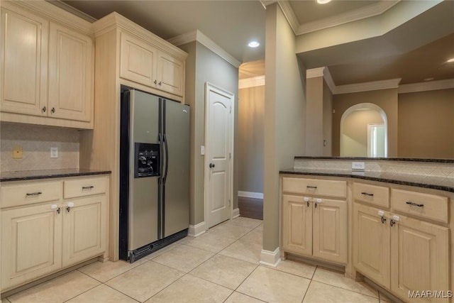 5906 Amberwood Ln, Montgomery, AL 36116 - kitchen featuring stainless steel refrigerator with ice dispenser, ornamental molding, backsplash, dark stone counters, and recessed lighting