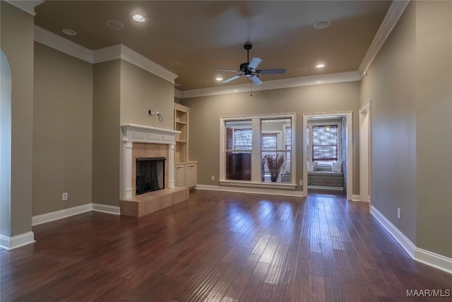 5906 Amberwood Ln, Montgomery, AL 36116 - unfurnished living room featuring a ceiling fan, ornamental molding, dark wood finished floors, a tile fireplace, and recessed lighting