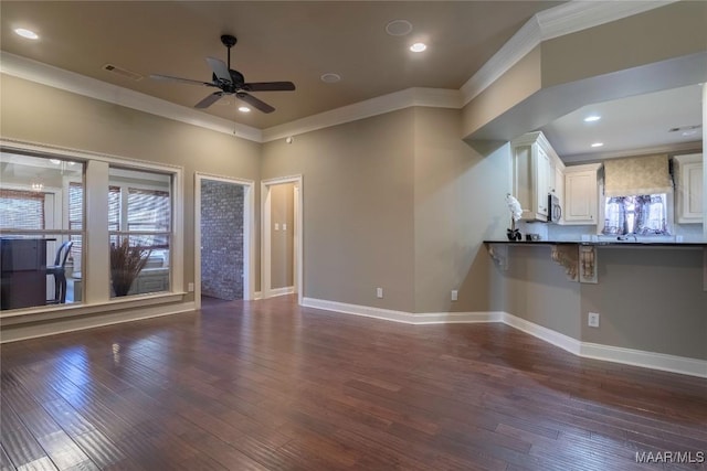 5906 Amberwood Ln, Montgomery, AL 36116 - unfurnished living room with ornamental molding, ceiling fan, dark wood-type flooring, and recessed lighting