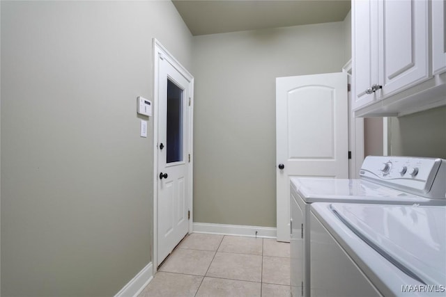 5906 Amberwood Ln, Montgomery, AL 36116 - laundry area with washer and dryer, cabinet space, and light tile patterned floors