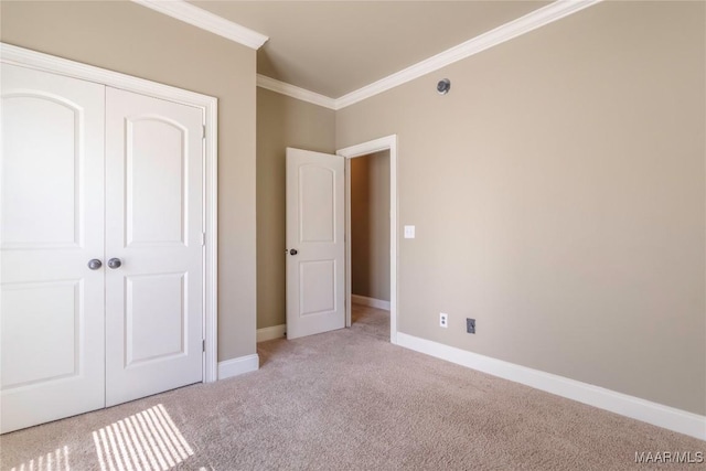 5906 Amberwood Ln, Montgomery, AL 36116 - unfurnished bedroom with crown molding, carpet, and a closet