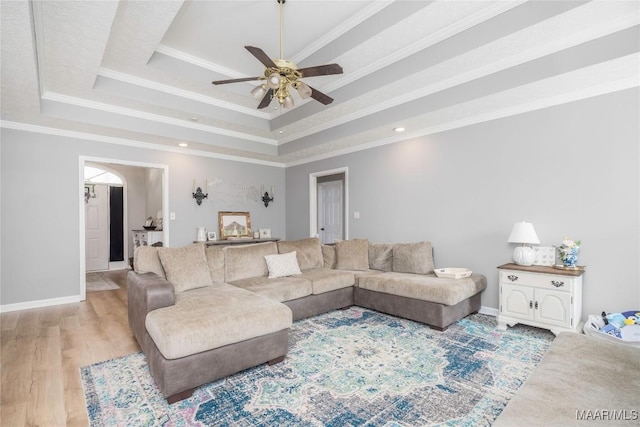 1274 Cross Creek Rd, Prattville, AL 36067 - living room featuring a ceiling fan, a raised ceiling, light wood-style flooring, baseboards, and ornamental molding