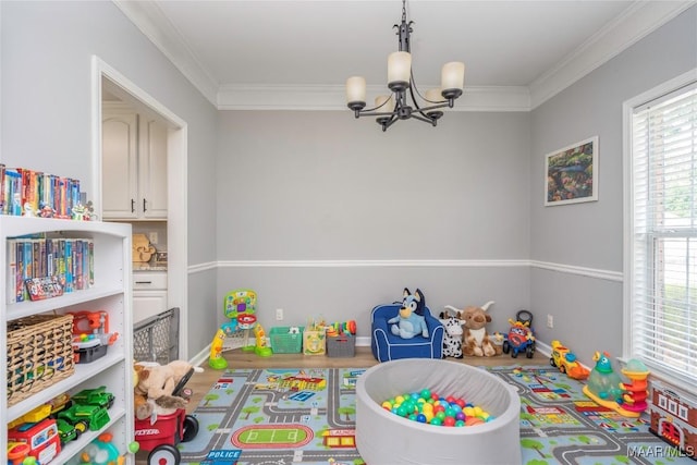 1274 Cross Creek Rd, Prattville, AL 36067 - rec room with a chandelier, crown molding, and baseboards