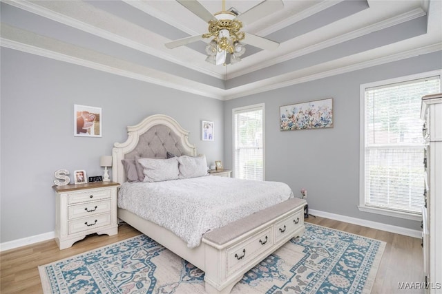 1274 Cross Creek Rd, Prattville, AL 36067 - bedroom featuring a tray ceiling, light wood finished floors, baseboards, crown molding, and ceiling fan