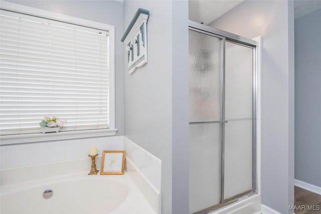 1274 Cross Creek Rd, Prattville, AL 36067 - full bathroom with a shower stall, a bath, and a textured ceiling