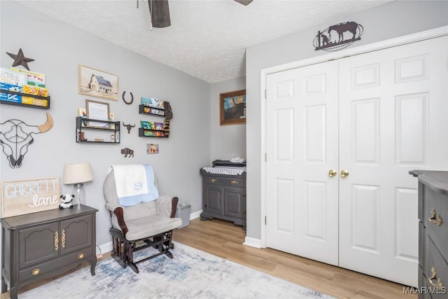 1274 Cross Creek Rd, Prattville, AL 36067 - sitting room featuring wood finished floors, a textured ceiling, baseboards, and ceiling fan