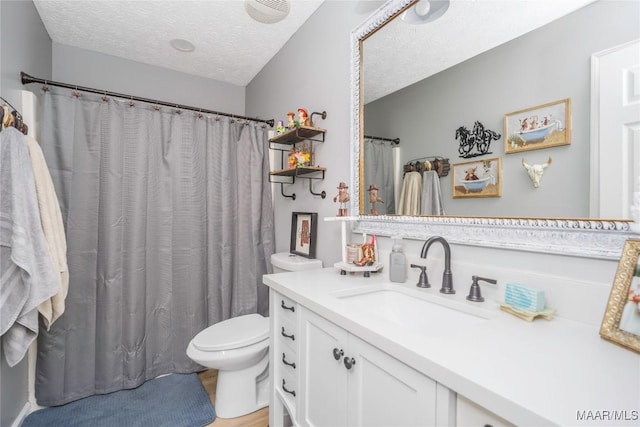1274 Cross Creek Rd, Prattville, AL 36067 - bathroom with a textured ceiling, toilet, vanity, and a shower with shower curtain