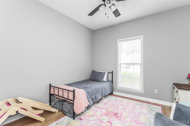 1274 Cross Creek Rd, Prattville, AL 36067 - bedroom with wood finished floors, baseboards, and a ceiling fan