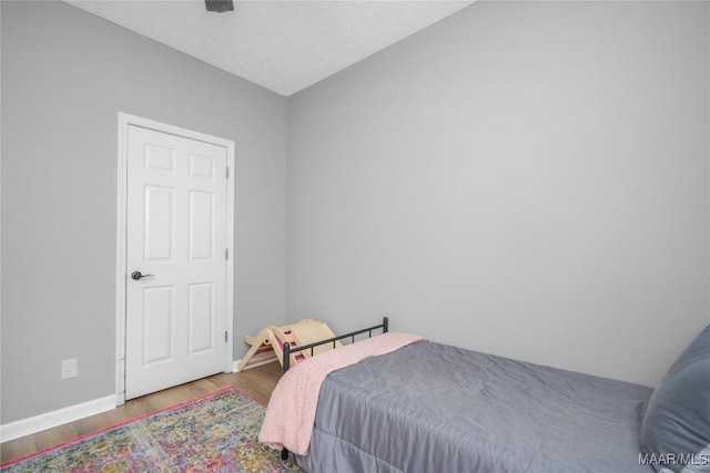 1274 Cross Creek Rd, Prattville, AL 36067 - bedroom with wood finished floors and baseboards