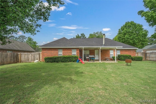 1274 Cross Creek Rd, Prattville, AL 36067 - back of house featuring a patio, brick siding, and roof with shingles