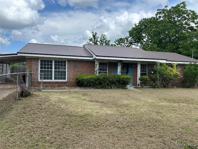 707 King Ln, Selma, AL 36701 - ranch-style house featuring an attached carport, metal roof, and brick siding