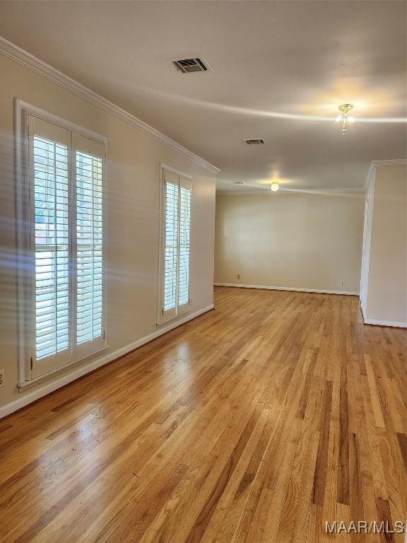 305 Sterling Dr, Montgomery, AL 36109 - empty room with ornamental molding, light wood-type flooring, and baseboards