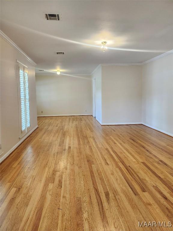 305 Sterling Dr, Montgomery, AL 36109 - unfurnished room featuring ornamental molding, light wood-style floors, and baseboards