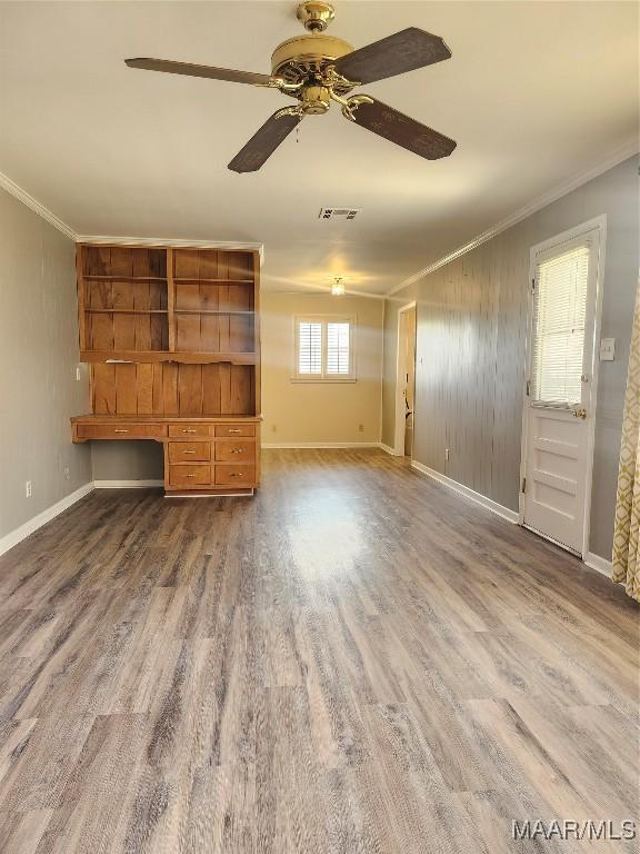 305 Sterling Dr, Montgomery, AL 36109 - unfurnished living room featuring crown molding, wood finished floors, ceiling fan, and baseboards