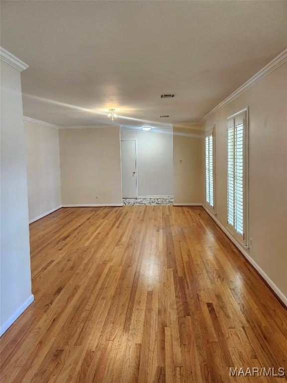 305 Sterling Dr, Montgomery, AL 36109 - unfurnished room with ornamental molding, light wood-style flooring, and baseboards