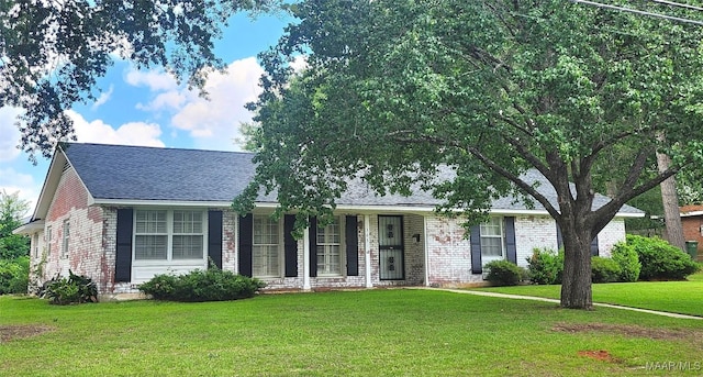 305 Sterling Dr, Montgomery, AL 36109 - ranch-style home with brick siding, a front yard, and roof with shingles