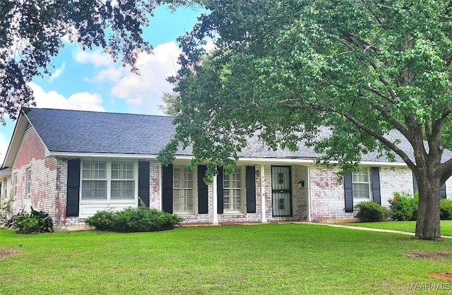 305 Sterling Dr, Montgomery, AL 36109 - single story home featuring brick siding, a front lawn, roof with shingles, and a porch