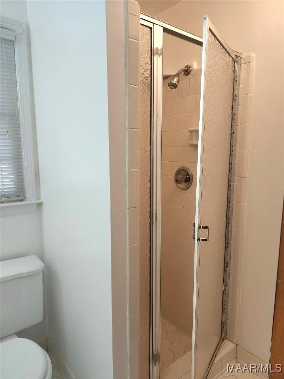 305 Sterling Dr, Montgomery, AL 36109 - full bathroom featuring a shower stall and toilet
