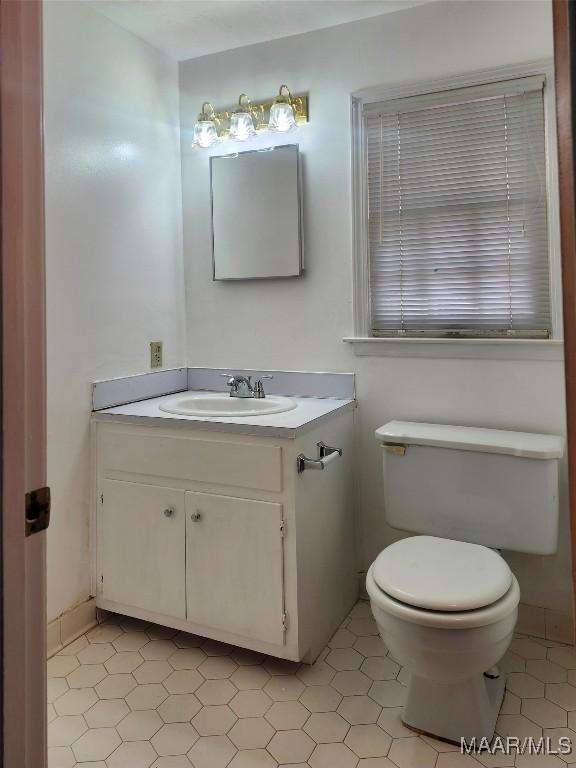 305 Sterling Dr, Montgomery, AL 36109 - bathroom featuring toilet, vanity, and tile patterned floors