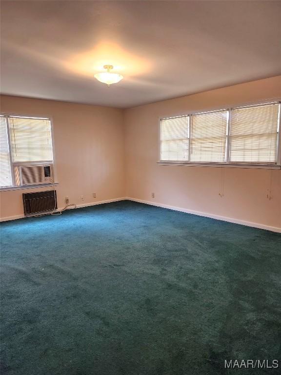 305 Sterling Dr, Montgomery, AL 36109 - empty room featuring cooling unit, dark colored carpet, and baseboards