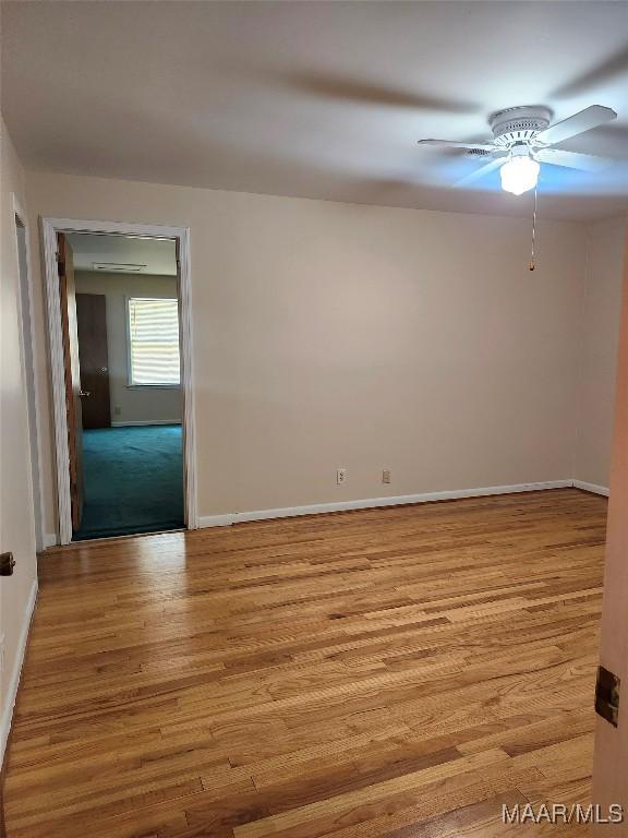 305 Sterling Dr, Montgomery, AL 36109 - unfurnished room with a ceiling fan, wood finished floors, and baseboards
