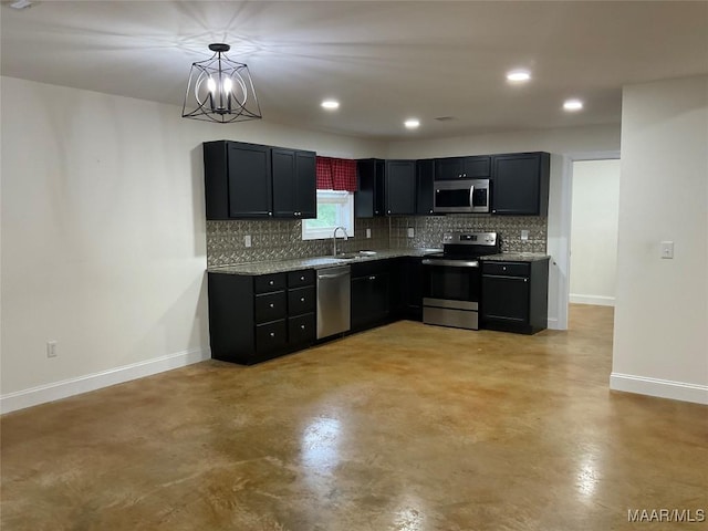 215 Indian Ln, Tallassee, AL 36078 - kitchen featuring appliances with stainless steel finishes, a sink, concrete floors, baseboards, and tasteful backsplash