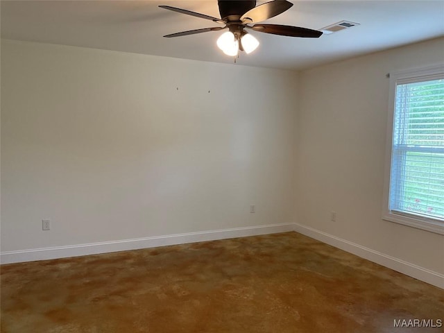 215 Indian Ln, Tallassee, AL 36078 - empty room featuring ceiling fan, concrete floors, and baseboards