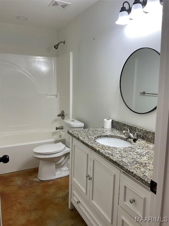 215 Indian Ln, Tallassee, AL 36078 - full bath featuring vanity, toilet, shower / bathtub combination, and finished concrete flooring