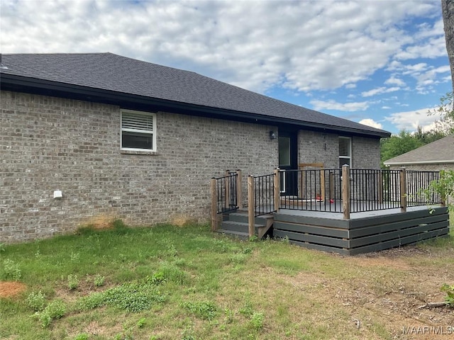 215 Indian Ln, Tallassee, AL 36078 - rear view of house featuring brick siding, roof with shingles, and a wooden deck