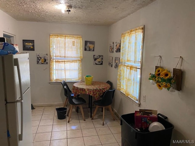 1734 Champion St, Montgomery, AL 36110 - dining room featuring light tile patterned floors and a textured ceiling