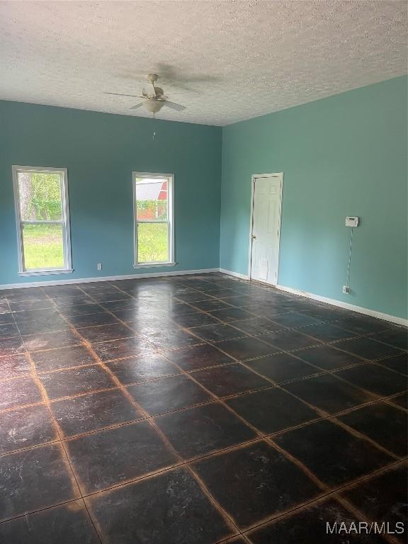 8130 Sorrel Ln, Montgomery, AL 36117 - unfurnished room with ceiling fan, a textured ceiling, and baseboards