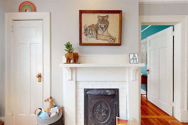 1207 Woodward Ave, Montgomery, AL 36106 - detailed view of wood finished floors and a tile fireplace