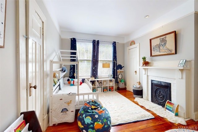 1207 Woodward Ave, Montgomery, AL 36106 - playroom with wood finished floors and a fireplace