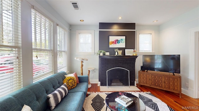 1207 Woodward Ave, Montgomery, AL 36106 - living area with wood finished floors, baseboards, a fireplace, and recessed lighting