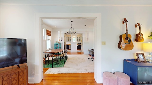 1207 Woodward Ave, Montgomery, AL 36106 - corridor featuring light wood-style flooring, a chandelier, and baseboards