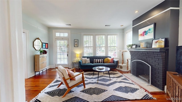 1207 Woodward Ave, Montgomery, AL 36106 - living area featuring wood finished floors, a fireplace, and recessed lighting