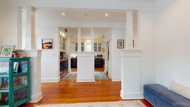 1207 Woodward Ave, Montgomery, AL 36106 - corridor with light wood finished floors, decorative columns, recessed lighting, and baseboards