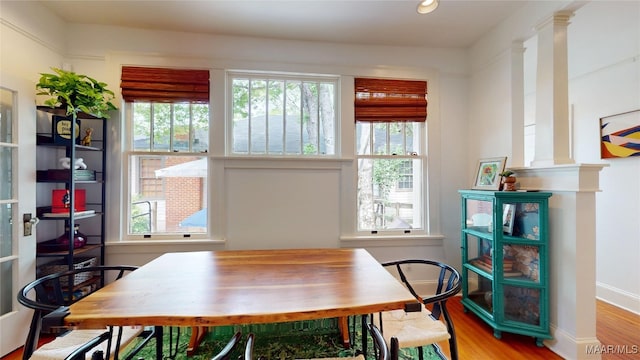 1207 Woodward Ave, Montgomery, AL 36106 - dining area featuring plenty of natural light, wood finished floors, ornate columns, and baseboards
