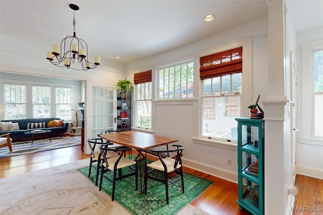 1207 Woodward Ave, Montgomery, AL 36106 - dining space featuring healthy amount of natural light, wood finished floors, a chandelier, baseboards, and recessed lighting