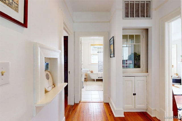 1207 Woodward Ave, Montgomery, AL 36106 - hallway featuring light wood-style flooring