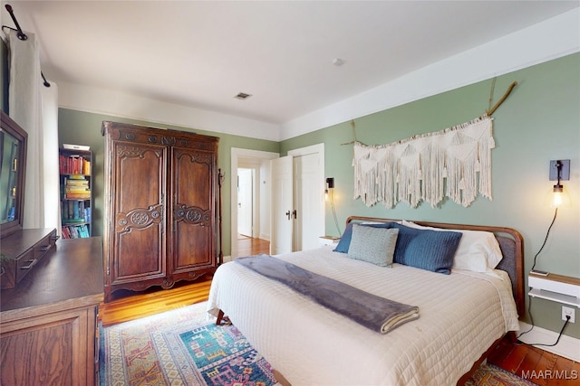 1207 Woodward Ave, Montgomery, AL 36106 - bedroom with light wood-type flooring and baseboards