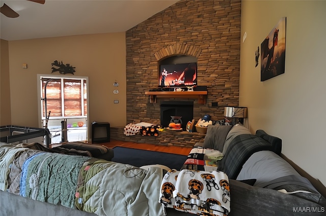 1496 County Road 81st Rd, Prattville, AL 36067 - living area featuring lofted ceiling, ceiling fan, a stone fireplace, and wood finished floors