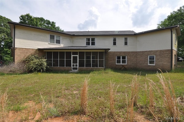 1496 County Road 81st Rd, Prattville, AL 36067 - back of house with brick siding, a sunroom, and a yard