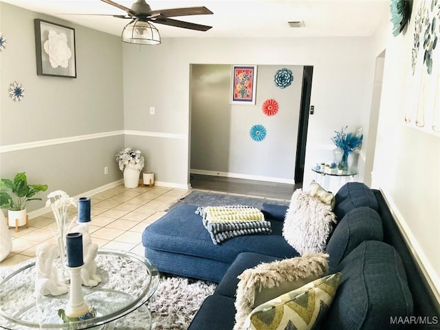 452 Planters Rd, Montgomery, AL 36109 - tiled living room featuring ceiling fan and baseboards