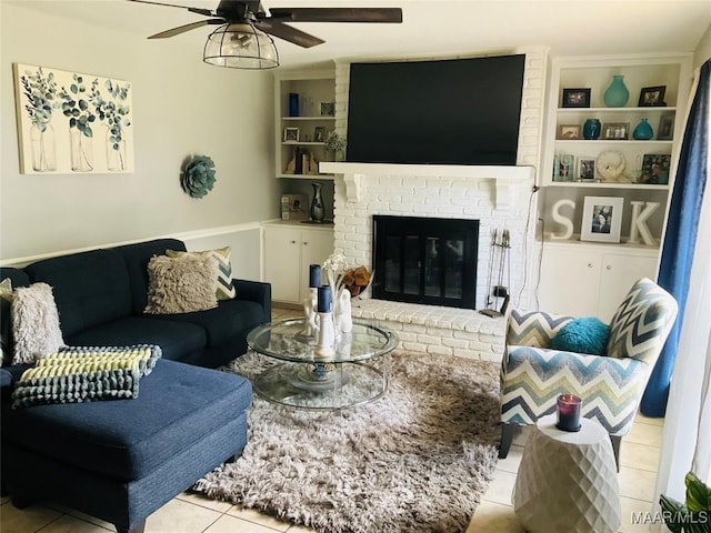 452 Planters Rd, Montgomery, AL 36109 - tiled living area featuring built in features, ceiling fan, and a fireplace