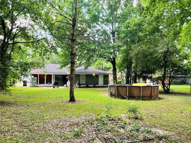 452 Planters Rd, Montgomery, AL 36109 - view of grassy yard featuring an outdoor pool