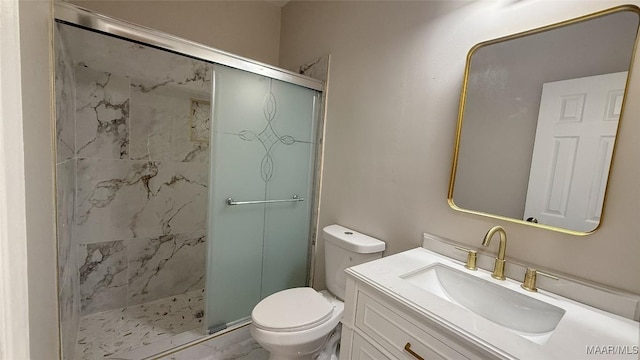 bathroom with a stall shower, toilet, and vanity