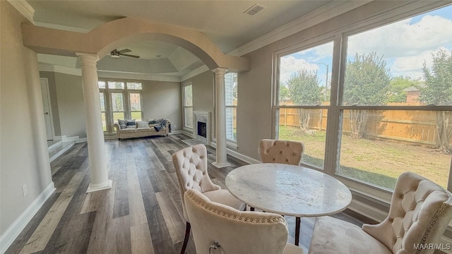 sunroom featuring arched walkways