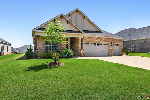 1430 Wildlife Way, Prattville, AL 36066 - craftsman house with board and batten siding, brick siding, an attached garage, a front yard, and driveway